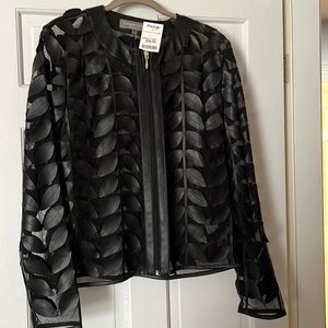 Sheer long sleeve w/“pleather” leaf detailing. Size M